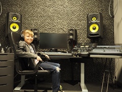 Boy sitting at a recording console