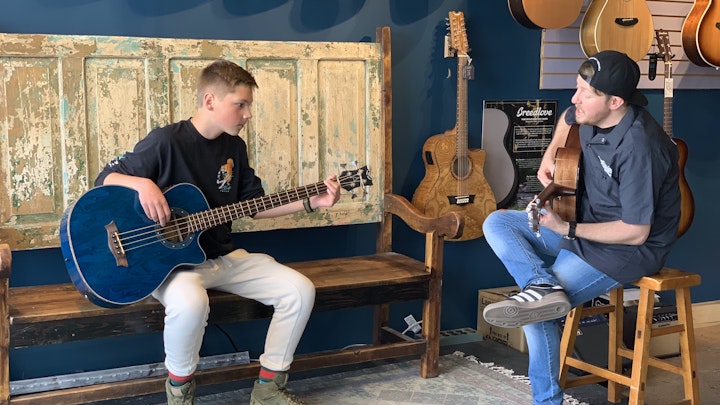 Teacher and student during a bass guitar lesson