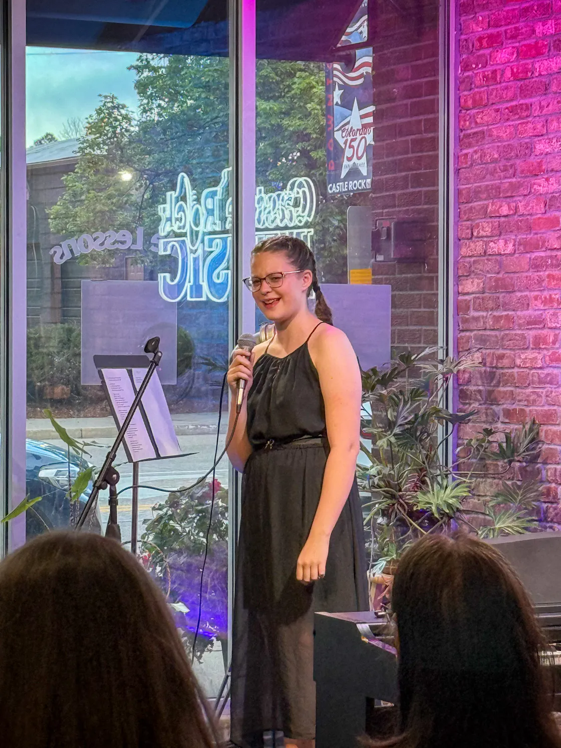 Performance: Student singer in a black dress